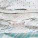 Swaddle Designs  ͵Թ͵͹ Muslin Swaddle Tiny Triangles Shimmer